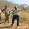 Minister being shown Cleared land